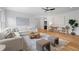 Spacious living room featuring hardwood floors, stylish furniture, and a modern ceiling fan at 3267 Sewell Mill Rd, Marietta, GA 30062