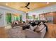 Spacious living room with hardwood floors, a wood-paneled ceiling, and sliding glass doors to the outdoor deck at 3267 Sewell Mill Rd, Marietta, GA 30062