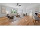Bright living room with hardwood floors, comfortable seating, and large windows with view at 3267 Sewell Mill Rd, Marietta, GA 30062