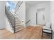 Inviting foyer with hardwood floors, staircase with iron railing, and abundant natural light at 3267 Sewell Mill Rd, Marietta, GA 30062