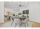 The dining area offers a stylish spot with modern lighting and views throughout the open-concept home at 34 Candler Ne Rd, Atlanta, GA 30317