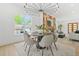 Bright dining area features a modern light fixture and an open view to the living room at 34 Candler Ne Rd, Atlanta, GA 30317