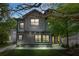 Two-story home featuring a modern gray exterior and a well-manicured lawn at 34 Candler Ne Rd, Atlanta, GA 30317