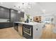 Modern kitchen with large island, stainless steel appliances, stylish countertops, and open floor plan at 34 Candler Ne Rd, Atlanta, GA 30317