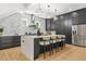 The spacious kitchen has granite counters, modern appliances, and an island with seating at 34 Candler Ne Rd, Atlanta, GA 30317