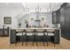 This stunning kitchen has an island with seating, modern lighting, and ample cabinet space at 34 Candler Ne Rd, Atlanta, GA 30317