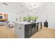 The gourmet kitchen has stainless steel appliances, a large island, and an open floor plan at 34 Candler Ne Rd, Atlanta, GA 30317