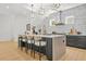 The kitchen features a marble backsplash, an island with seating, and modern stainless steel appliances at 34 Candler Ne Rd, Atlanta, GA 30317