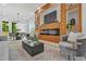 Contemporary living room with an electric fireplace, modern decor, and bright natural light at 34 Candler Ne Rd, Atlanta, GA 30317