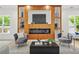 Stylish living room featuring a modern fireplace and ample seating at 34 Candler Ne Rd, Atlanta, GA 30317