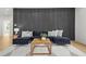 Modern living room showcasing a dark accent wall and sleek, contemporary decor at 34 Candler Ne Rd, Atlanta, GA 30317