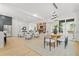 Open concept living area flows from kitchen and dining with fireplace and ample seating at 34 Candler Ne Rd, Atlanta, GA 30317