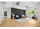 Stylish living room with decorative wall panel, modern lighting, and plush seating at 34 Candler Ne Rd, Atlanta, GA 30317