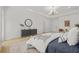 This is a main bedroom that features a chandelier, wood floors, and white walls at 34 Candler Ne Rd, Atlanta, GA 30317