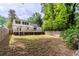 Spacious backyard with a deck and lush greenery, offering ample space for outdoor activities and relaxation at 1334 Milton Se Pl, Atlanta, GA 30316