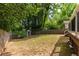 Spacious backyard with a wooden fence and a storage shed, providing ample space for outdoor activities at 1334 Milton Se Pl, Atlanta, GA 30316
