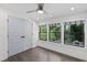 Bedroom with hardwood floors, large double door closet and three windows offering natural light and backyard view at 1334 Milton Se Pl, Atlanta, GA 30316