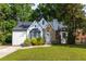 Charming home with stone accents and a well-manicured lawn, offering great curb appeal and a welcoming entrance at 1334 Milton Se Pl, Atlanta, GA 30316