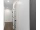 Clean, neutral hallway featuring hardwood floors and modern doors at 1334 Milton Se Pl, Atlanta, GA 30316