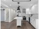 Modern kitchen with stainless steel appliances, subway tile backsplash, and an island at 1334 Milton Se Pl, Atlanta, GA 30316