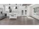 Modern kitchen with stainless steel appliances, a center island, and double doors leading to outdoor space at 1334 Milton Se Pl, Atlanta, GA 30316