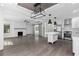 Spacious open floor plan with modern kitchen, cozy fireplace, and sliding barn door at 1334 Milton Se Pl, Atlanta, GA 30316