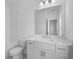 Bright bathroom with white tile, bathtub, and single vanity with framed mirror at 3167 Moor View Rd # 35, Duluth, GA 30096