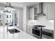 Bright kitchen featuring stainless steel appliances, a modern backsplash, and a large window at 3167 Moor View Rd # 35, Duluth, GA 30096