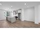 Bright, open kitchen featuring a large island, stainless steel appliances, and hardwood floors at 3167 Moor View Rd # 35, Duluth, GA 30096