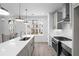 Well-lit kitchen features stainless steel appliances and a view to the outside at 3167 Moor View Rd # 35, Duluth, GA 30096