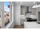 Kitchen with stainless steel appliances, white cabinets, and large windows at 3167 Moor View Rd # 35, Duluth, GA 30096