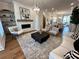 Spacious living room with fireplace, modern furniture, and wood floors at 3167 Moor View Rd # 35, Duluth, GA 30096