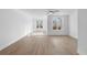 Spacious living area with hardwood floors, white walls and windows at 3167 Moor View Rd # 35, Duluth, GA 30096