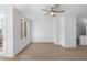 Bright and airy living room with hardwood floors, ceiling fan and large windows at 3167 Moor View Rd # 35, Duluth, GA 30096