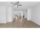 Spacious, open-concept living area with hardwood floors that connects to kitchen at 3167 Moor View Rd # 35, Duluth, GA 30096