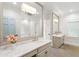 Elegant bathroom featuring a large mirror, marble countertops, and stylish fixtures at 5205 Riverview Nw Rd, Atlanta, GA 30327