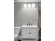 Stylish bathroom featuring a unique wallpaper and a sleek vanity at 5205 Riverview Nw Rd, Atlanta, GA 30327