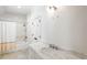 Stylish bathroom features a marble countertop vanity, shower and bathtub combination at 5205 Riverview Nw Rd, Atlanta, GA 30327