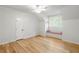 Sunlit bedroom boasts hardwood floors and a cozy window seat at 5205 Riverview Nw Rd, Atlanta, GA 30327