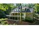 Multi-level home features stone accents and a rear deck at 5205 Riverview Nw Rd, Atlanta, GA 30327