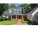 Traditional-style home with inviting covered front porch at 5205 Riverview Nw Rd, Atlanta, GA 30327