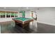 Game room with pool table and workout equipment in the adjacent room at 5205 Riverview Nw Rd, Atlanta, GA 30327