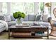 Comfortable living room featuring a plush sofa, coffee table with stylish decor and natural light, perfect for relaxation at 5205 Riverview Nw Rd, Atlanta, GA 30327