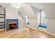 Bright room featuring hardwood floors, a fireplace and built-in window seating at 5205 Riverview Nw Rd, Atlanta, GA 30327