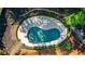 Aerial view of kidney-shaped pool and surrounding landscaping at 5205 Riverview Nw Rd, Atlanta, GA 30327