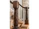 Close-up of a staircase featuring decorative carved wooden details and plush carpeting at 5205 Riverview Nw Rd, Atlanta, GA 30327