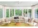 Sun-filled sun room with lots of windows offering peaceful views of nature at 5205 Riverview Nw Rd, Atlanta, GA 30327