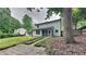 Spacious backyard, perfect for outdoor entertaining and relaxation, featuring lush greenery and the home's exterior at 5429 Martins Crossing Rd, Stone Mountain, GA 30088