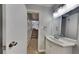 Charming half bathroom with a stylish vanity and a well-lit mirror for everyday convenience at 5429 Martins Crossing Rd, Stone Mountain, GA 30088