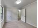 Bedroom boasts neutral color palette, natural light from a window, and two closets, optimizing space at 5429 Martins Crossing Rd, Stone Mountain, GA 30088
